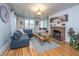 Inviting living room with hardwood floors, fireplace, and bay window with cozy bench seating at 69 Folly Road Blvd, Charleston, SC 29407