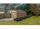 A brick shed with a secure, wooden door provides great outdoor storage at 69 Folly Road Blvd, Charleston, SC 29407