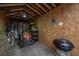 Interior of shed featuring plywood walls and items for lawn care and maintenance at 69 Folly Road Blvd, Charleston, SC 29407