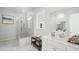 Modern bathroom featuring a glass-enclosed shower with marble tile and dual sink vanities at 1004 Tulip Shell, Summerville, SC 29485