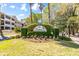 An entrance sign for a luxury condominium complex, surrounded by lush greenery at 1025 Riverland Woods Pl # 314, Charleston, SC 29412