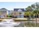 Beautiful pond view with fountain and charming coastal home with two-car garage at 1135 Kincannon Dr, Mount Pleasant, SC 29464