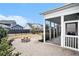 Cozy backyard with a screened porch, brick patio, and inviting fire pit perfect for outdoor gatherings at 119 Philips Park St, Summerville, SC 29486