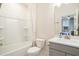 Bathroom featuring a sink, bathtub, and shower combination with a view to the bedroom through the mirror at 119 Philips Park St, Summerville, SC 29486