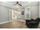 Bright bedroom with ample natural light, ceiling fan, and beautiful hardwood floors at 119 Philips Park St, Summerville, SC 29486