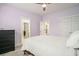 Bedroom featuring a fan, carpet, and ensuite bathroom and closet entries at 119 Philips Park St, Summerville, SC 29486