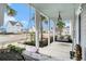 Inviting front porch with porch swings, offering scenic neighborhood views at 119 Philips Park St, Summerville, SC 29486