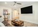 An entertainment room featuring a large screen television and hardwood floors at 119 Philips Park St, Summerville, SC 29486
