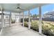 The screened porch offers a view of the detached garage and manicured backyard at 119 Philips Park St, Summerville, SC 29486