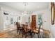 Bright dining room with a chandelier, traditional furniture, an oriental rug, and views of the living room and patio at 121 Shipyard Rd, Mount Pleasant, SC 29464