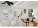 Comfortable living room with white decor, stylish seating, french doors, and a coffered ceiling with a fan at 121 Shipyard Rd, Mount Pleasant, SC 29464