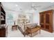 Relaxing main bedroom with a ceiling fan, hardwood furnishings, and plantation shutters for natural light at 121 W Shipyard Rd, Mount Pleasant, SC 29464