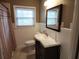 Bathroom with a decorative sink and vanity, toilet, window, mirror, and shower at 1216 Eastwood Ave, Hanahan, SC 29410