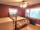 Bedroom featuring a ceiling fan, two windows, hardwood floor and a large bed at 1216 Eastwood Ave, Hanahan, SC 29410