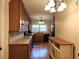 Functional kitchen equipped with wood cabinets, tile countertops and backsplash, and modern appliances at 1216 Eastwood Ave, Hanahan, SC 29410