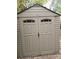 Tan shed with double doors and windows offering secure outdoor storage at 1216 Eastwood Ave, Hanahan, SC 29410
