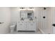 Updated bathroom featuring dual sinks, a vanity, updated fixtures, and tiled walk-in shower at 1226 Pickens St, Hanahan, SC 29410