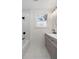 Bathroom with a shower-tub, double vanity, marble floors, and elegant lighting at 1226 Pickens St, Hanahan, SC 29410