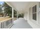Covered porch view with white railings, painted floor, white columns, and recessed lighting at 1226 Pickens St, Hanahan, SC 29410