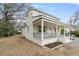 Inviting exterior showcasing a covered porch with railing, steps, and manicured landscaping at 1226 Pickens St, Hanahan, SC 29410