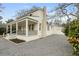 Charming home with a covered front porch and a gravel driveway offering ample parking space at 1226 Pickens St, Hanahan, SC 29410