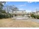 Charming two-story home with a covered front porch and well-maintained front yard at 1226 Pickens St, Hanahan, SC 29410
