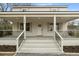 Classic home exterior featuring a covered front porch, white columns, and updated landscaping at 1226 Pickens St, Hanahan, SC 29410