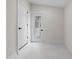 Entryway with neutral paint, white tile floors, and a side door with a window insert at 1226 Pickens St, Hanahan, SC 29410