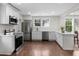 Modern kitchen with stainless steel appliances, white cabinets, and hardwood floors at 1226 Pickens St, Hanahan, SC 29410