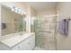 Well-lit bathroom with a glass-enclosed shower and vanity at 130 River Landing Dr # 7123, Charleston, SC 29492