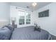 Bedroom featuring a tray on the bed, ceiling fan, and bright windows at 130 River Landing Dr # 7123, Charleston, SC 29492