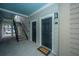 Apartment building entrance with stairs, painted doorframes and welcome mat at 130 River Landing Dr # 7123, Charleston, SC 29492