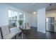 Bright dining area features hardwood floors and a glass table near large windows at 130 River Landing Dr # 7123, Charleston, SC 29492