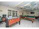 Recreational game room featuring a billiards table, foosball, and comfortable lounge area at 130 River Landing Dr # 7123, Charleston, SC 29492