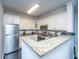 Well-equipped kitchen with granite counters, stainless steel appliances, and ample cabinet space at 130 River Landing Dr # 7123, Charleston, SC 29492
