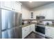 Modern kitchen featuring stainless steel appliances, granite countertops, and light cabinetry at 130 River Landing Dr # 7123, Charleston, SC 29492