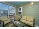 Cozy screened-in porch with comfortable seating, great for relaxing outdoors at 130 River Landing Dr # 7123, Charleston, SC 29492
