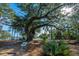 Picturesque scene featuring a majestic, old tree and beautiful waterfront views in a natural, wooded setting at 130 River Landing Dr # 7123, Charleston, SC 29492