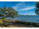 Scenic water view and bridge beyond a park bench at 130 River Landing Dr # 7123, Charleston, SC 29492