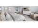 Serene bedroom showcasing soft blue tones, a cozy bench, and ample natural light at 131 Threaded Fern St, Summerville, SC 29485