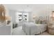 Bright bedroom with patterned accent wall, white furniture, and view to the outside at 131 Threaded Fern St, Summerville, SC 29485