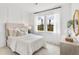 Bright bedroom showcasing a large window, natural light, and simple, elegant decor at 131 Threaded Fern St, Summerville, SC 29485