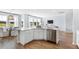 Modern kitchen featuring stainless steel appliances, a large island, and an adjacent living room area at 131 Threaded Fern St, Summerville, SC 29485