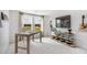Inviting home office featuring shiplap walls, guitar, and views of greenery at 131 Threaded Fern St, Summerville, SC 29485
