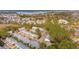 Aerial view of a residential neighborhood with lush greenery and a nearby lake at 136 Fair Sailing Rd, Mount Pleasant, SC 29466