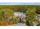 Aerial view of colorful townhomes, surrounded by tall green trees with roads winding throughout at 136 Fair Sailing Rd, Mount Pleasant, SC 29466