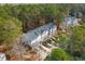 Aerial view of townhomes with a backdrop of lush green trees and neighborhood roads at 136 Fair Sailing Rd, Mount Pleasant, SC 29466
