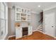 Breakfast nook with white cabinets and a beverage fridge that's close to the staircase at 136 Fair Sailing Rd, Mount Pleasant, SC 29466