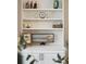 Close up of shelving with modern decor pieces, cabinet doors, and accent items at 136 Fair Sailing Rd, Mount Pleasant, SC 29466