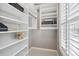 Bright closet with shelves and a window with light filtering blinds at 136 Fair Sailing Rd, Mount Pleasant, SC 29466